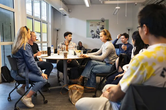 VALIDATE A group of people discuss in a group
